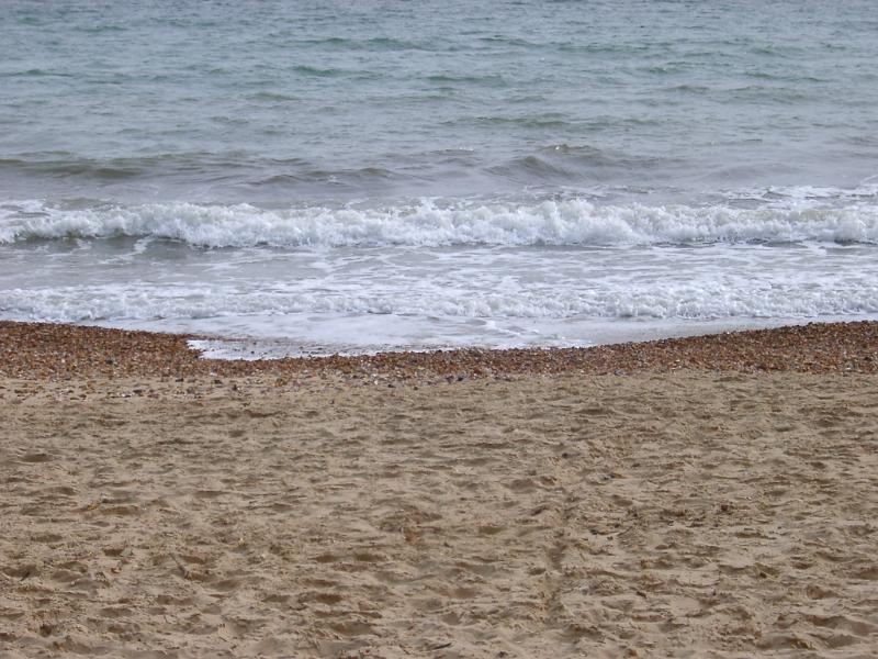 Free Stock Photo: waves lapping on a sandy shoreline