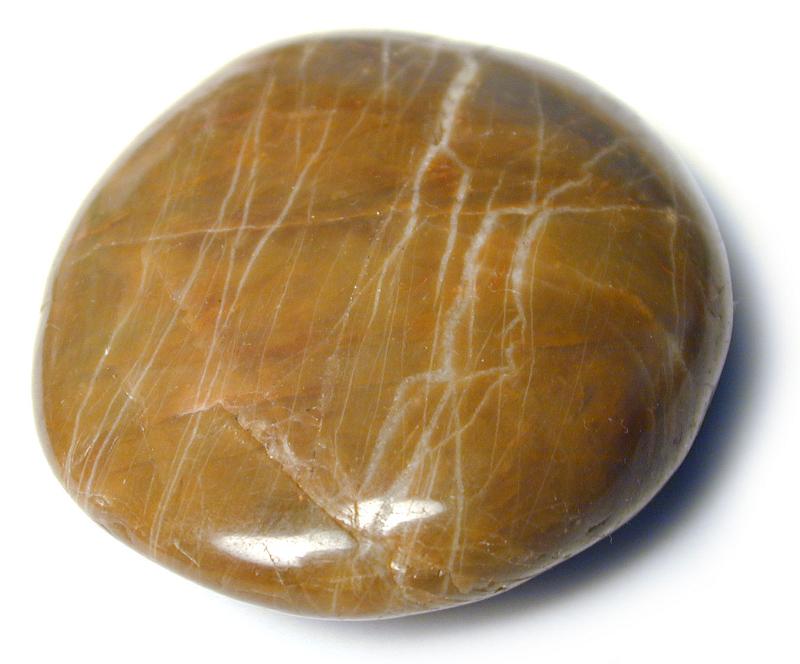 Free Stock Photo: Smooth round flat waterworn agate pebble eroded by the tumbling action of the waves in the ocean or river on a white background