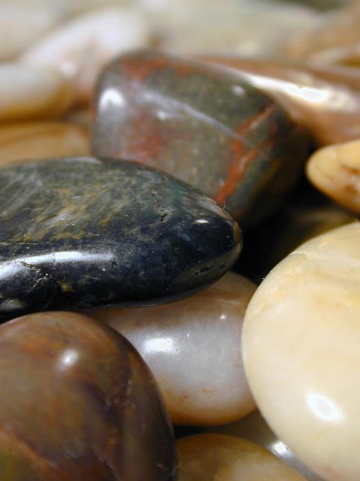 Free Stock Photo: Collection of smooth pebbles or stones with their surfaces eroded to a smooth shine by the tumbling action of water in the sea or river