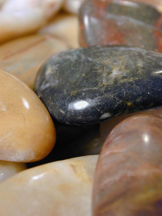 Free Stock Photo: a background of smooth rounded polished pebbles of assorted colours