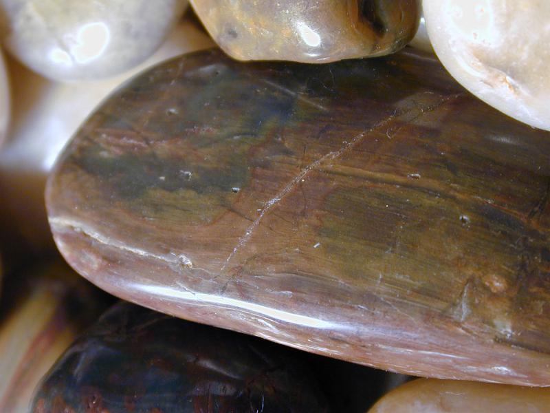 Free Stock Photo: Extreme Close Up of Smooth Polished Stone Stacked with Other Stones