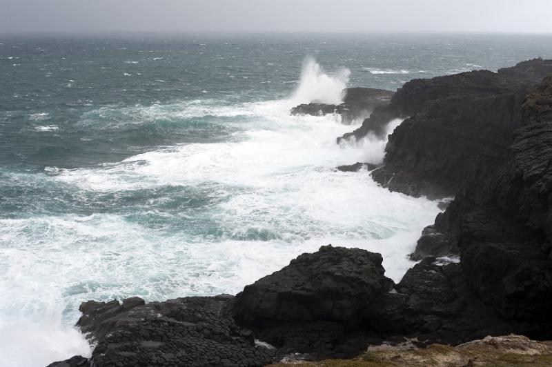 Free Stock Photo: waves crashing against a rough foreboding coastline