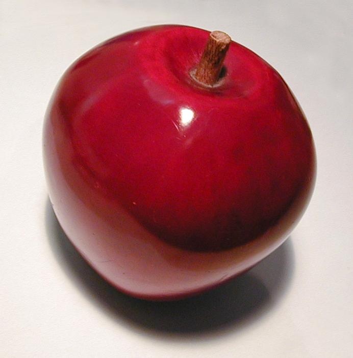Free Stock Photo: A decorative red ceramic apple on light background