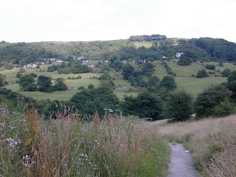 Free Stock Photo: Footpath leading cross rolling hills with distant houses on the hilltop and a wooded valley below