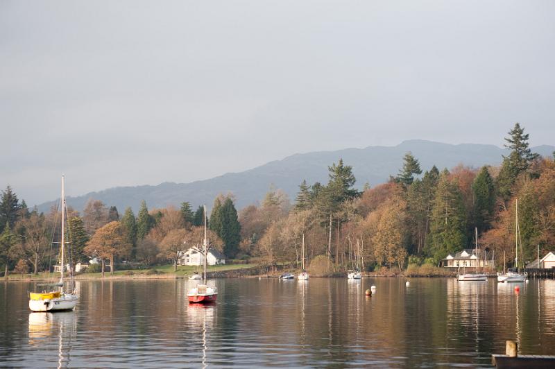 Free Stock Photo: Boats moored on the tranquil waters of Lake Windermere, Cumbria in a scenic autumn landscape with reflections