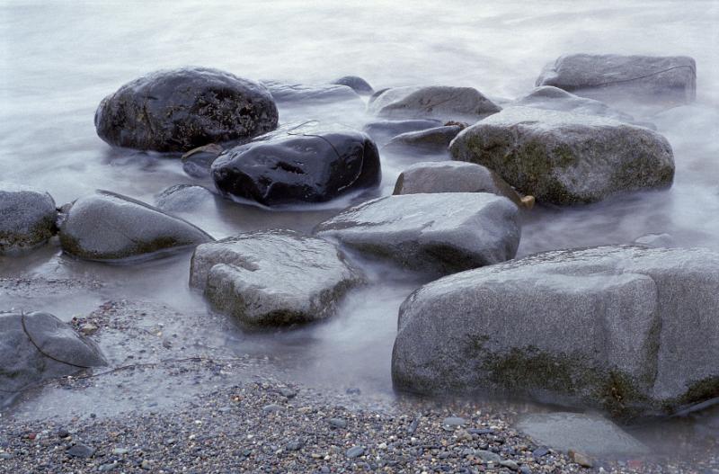 Free Stock Photo: water washed rounded stones in a shallow pool of water