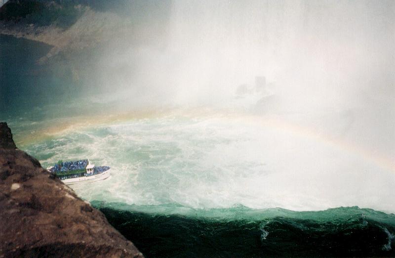 Free Stock Photo: Rainbow in the cloud of fine spray and mist over Niagara Falls with turbulent white water below