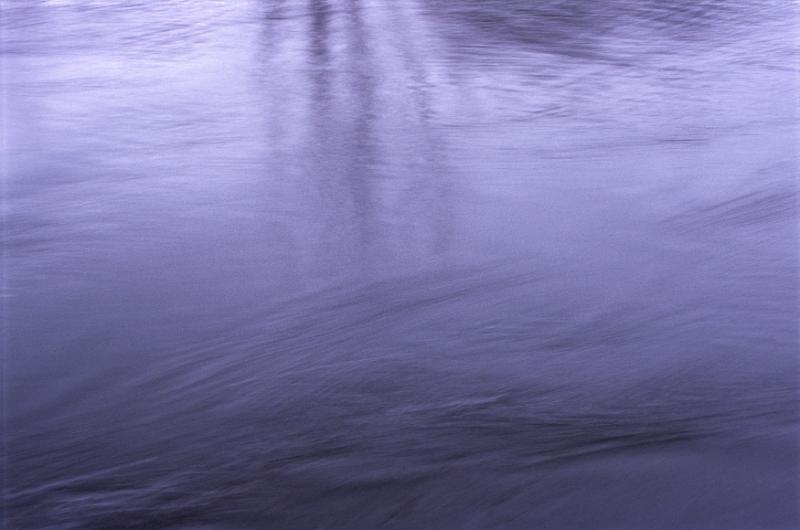 Free Stock Photo: cold blue ethereal image of flowing water with abstract reflections of trees
