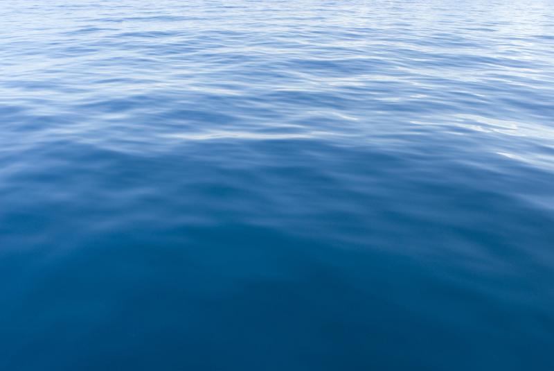 Free Stock Photo: Background texture of the surface of blue sea water with ripples and reflections of sunlight for nautical or marine themed concepts