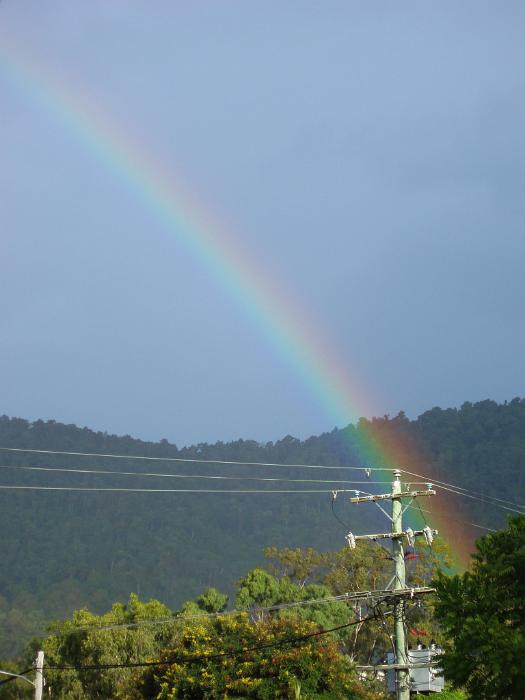 Free Stock Photo: a rainbow ending over a pole mounted power transformer