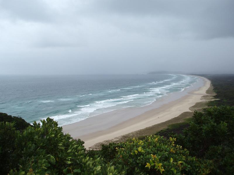 Free Stock Photo: rain clouds and waves blown onto the coast  and a sandy beach