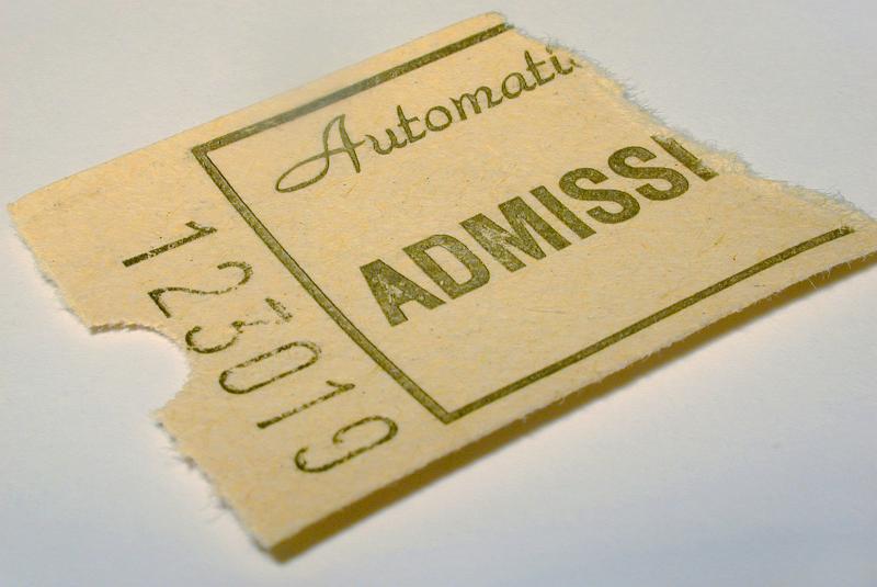 Free Stock Photo: Used torn admission ticket with unique number for entry to a venue or service