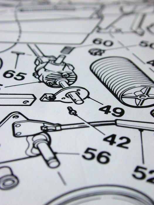 Free Stock Photo: Exploded diagram showing component parts of a machine each numbered for identification in an oblique angle view