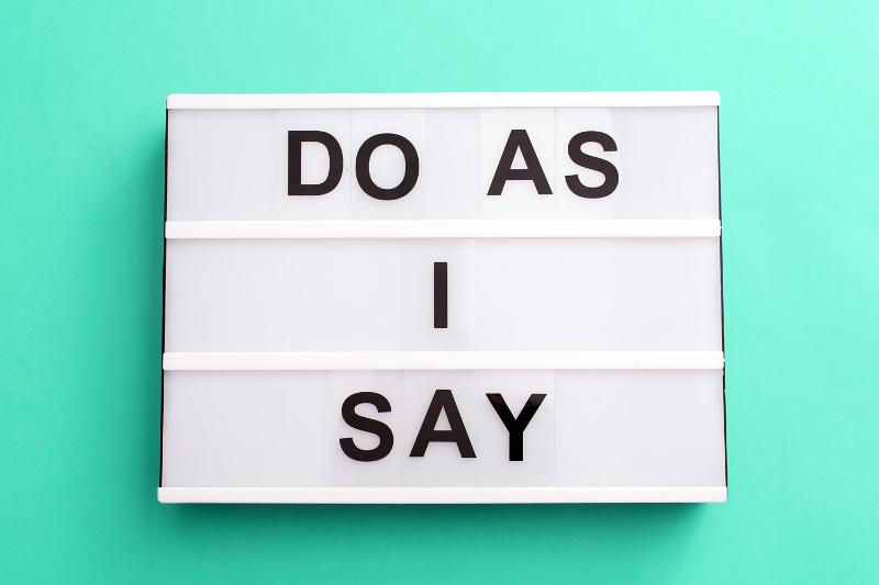 Free Stock Photo: Do As I Say meme in capital letters on a small light box over a green background