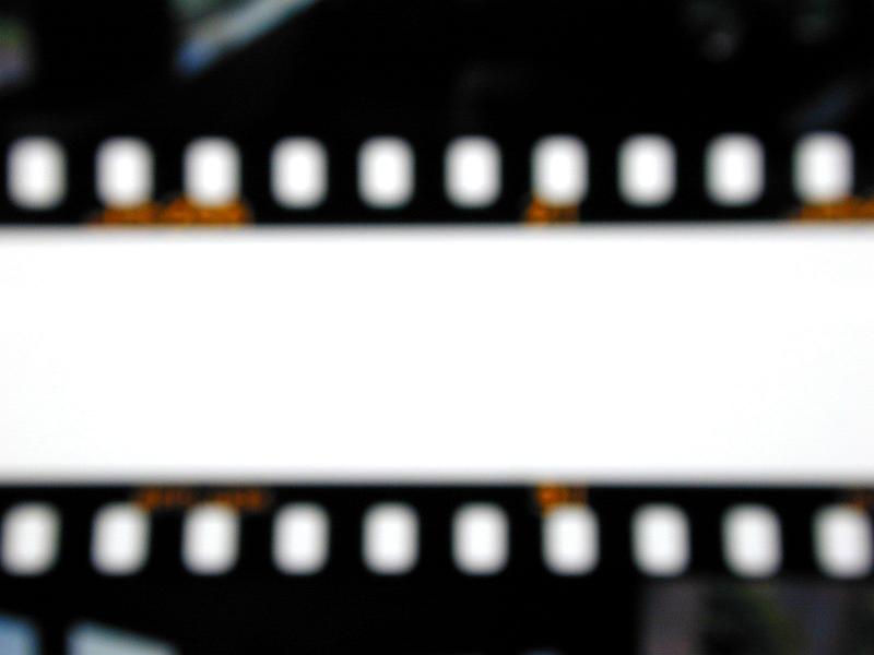 Free Stock Photo: Strips of a film with edges blurred on white background, cropped close-up backdrop concept