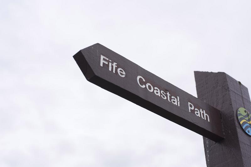 Free Stock Photo: Route marker for the Fife Coastal Path viewed from below against a high key sky with copy space