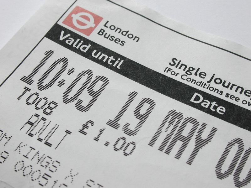 Free Stock Photo: London bus ticket for single journey for adult with valid date and time printed, viewed in close-up on white background. Public transportation concept