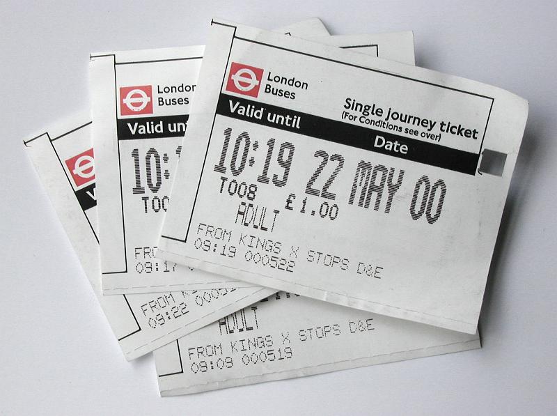Free Stock Photo: A close up of multiple London bus tickets on a white background with copy space.