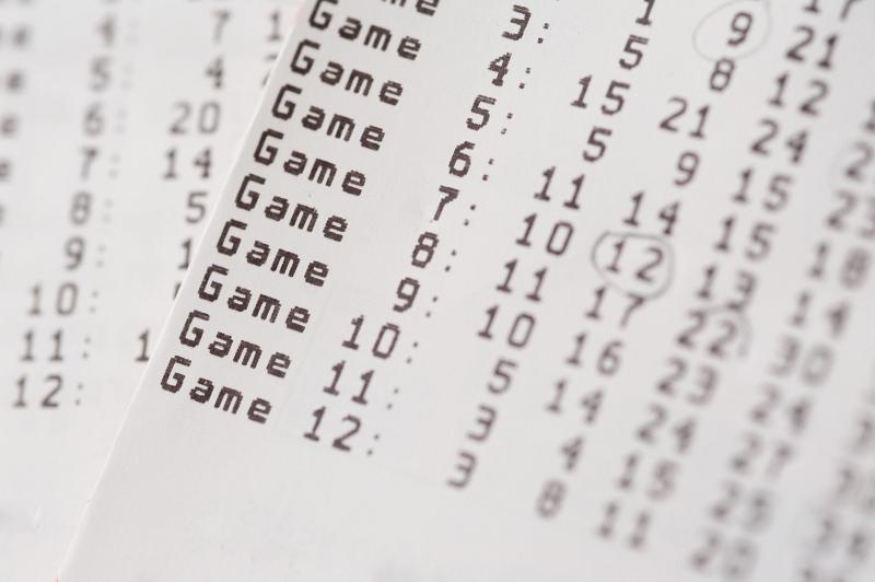 Free Stock Photo: Close up on a card showing twelve sets of lottery numbers with selective focus to the word Game in a concept of luck and winning