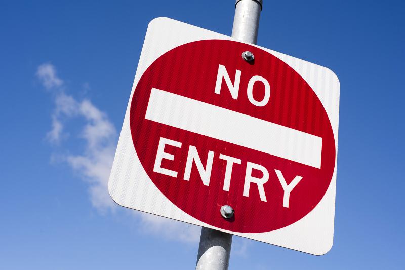 Free Stock Photo: Red and white No Entry sign on a metal pole viewed low angle against a blue sky