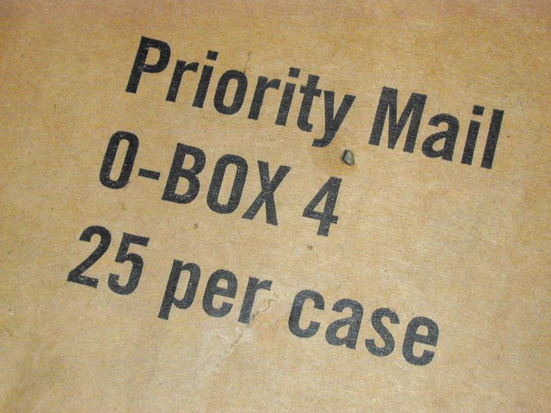 Free Stock Photo: Brown cardboard packaging box for Priority mail with associated text viewed close up