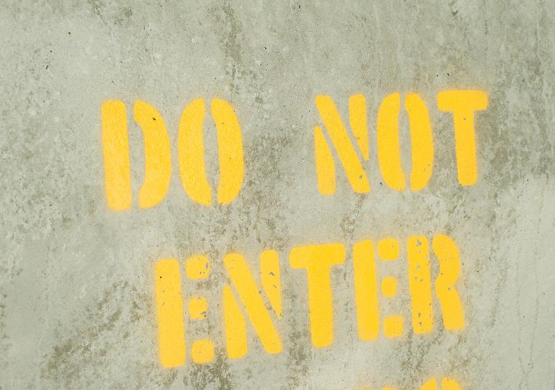 Free Stock Photo: Yellow Do Not Enter sign stencilled on road surface viewed from above forbidding access