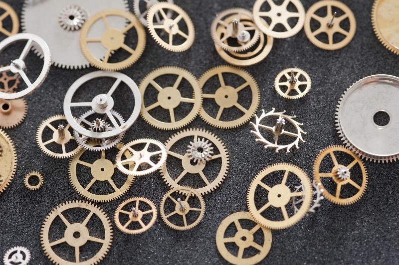 Free Stock Photo: an assortment of tiny brass gears and cog wheels, components from a clock or pocket watch