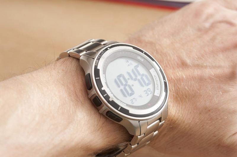 Free Stock Photo: Man displaying his modern metal digital wristwatch holding up his arm at an angle