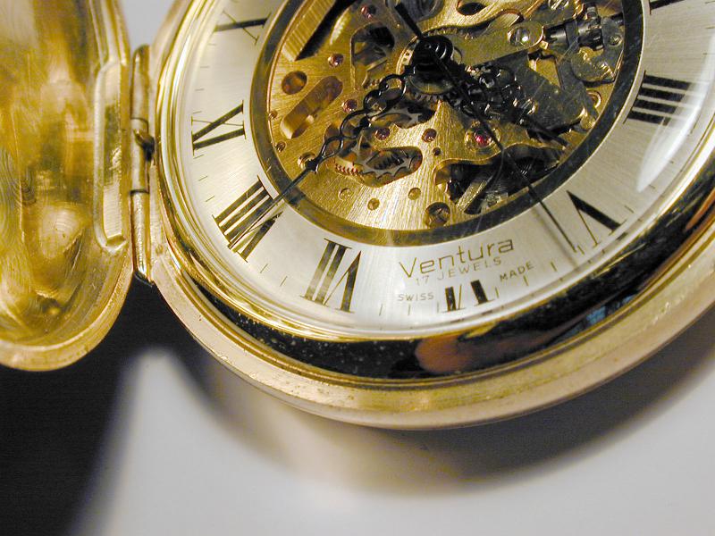 Free Stock Photo: close up on the hands and mechanism of a swiss made pocket watch