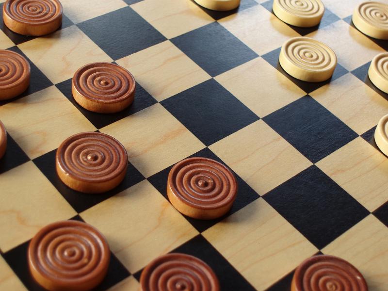 Free Stock Photo: wooden pieces set up on a checkers game board