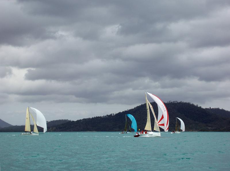 Free Stock Photo: four yachts racing on a stormy looking day