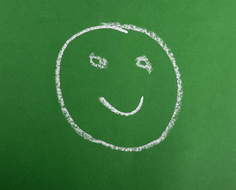 Free Stock Photo: a smiling happy face drawing in chalk on a green background