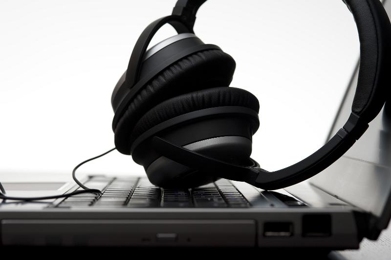 Free Stock Photo: a pair of hi fi headphones resting on a laptop computer