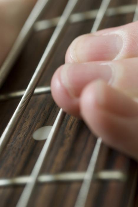 Free Stock Photo: finger playing a bass guitar