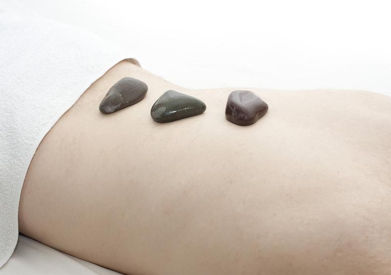 Free Stock Photo: pampering tense muscles with a hot stone back massage