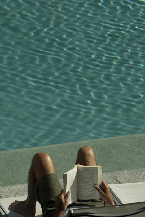 Free Stock Photo: a nice way to relax - reading a book by the pool side