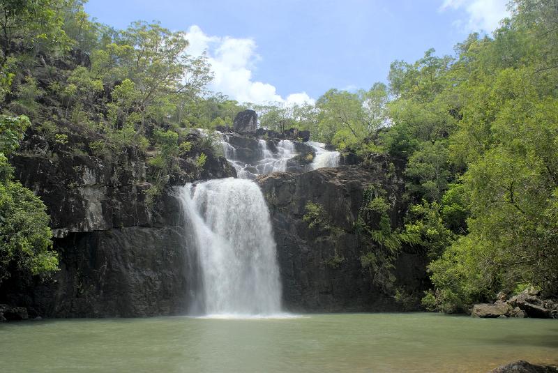 Download image of lush tropical waterfall Free Stock Photo: relaxing tropical waters, a place to cool off on a hot day under a waterfall