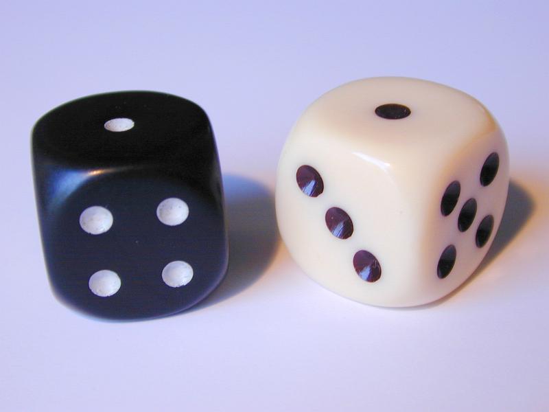 Free Stock Photo: snake eyes a pair of black and white gaming die - a game of chance