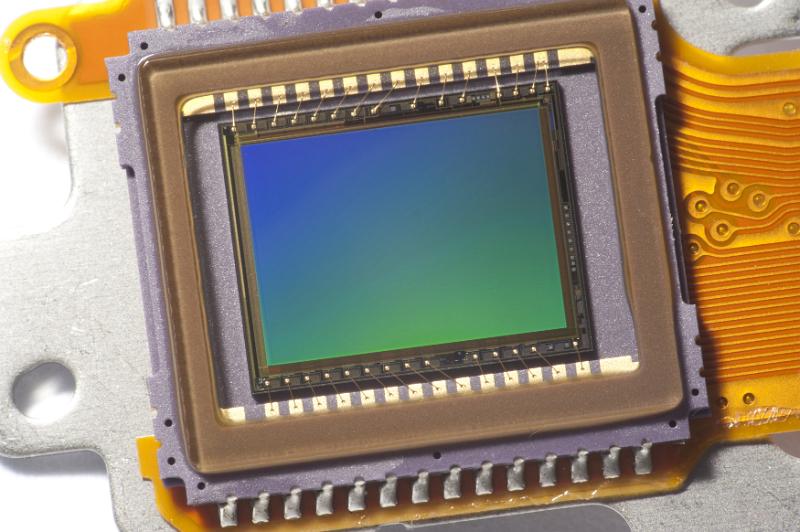 Free Stock Photo: CMOS image video sensor chip close-up green and blue gradient on the matrix
