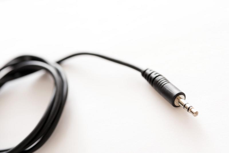 Free Stock Photo: A black coloured audio lead with 3.5mm TRS jack plug on the end