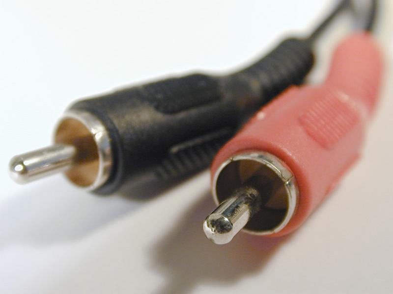 Free Stock Photo: Audio phono RCA connectors of black and red color, close-up macro view on white background