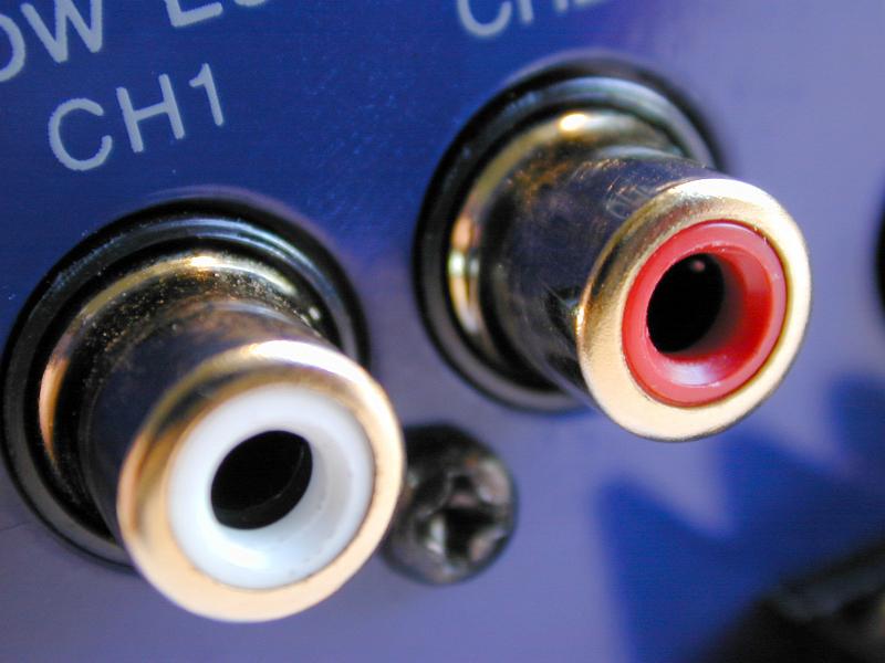Free Stock Photo: Detail image of RCA phono connections labeled with channel numbers on blue device back panel