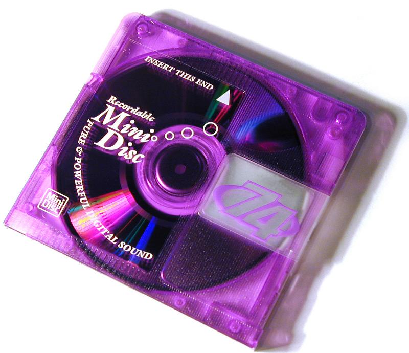Free Stock Photo: Purple glass case Mini Disc MD close-up on white background with shadow