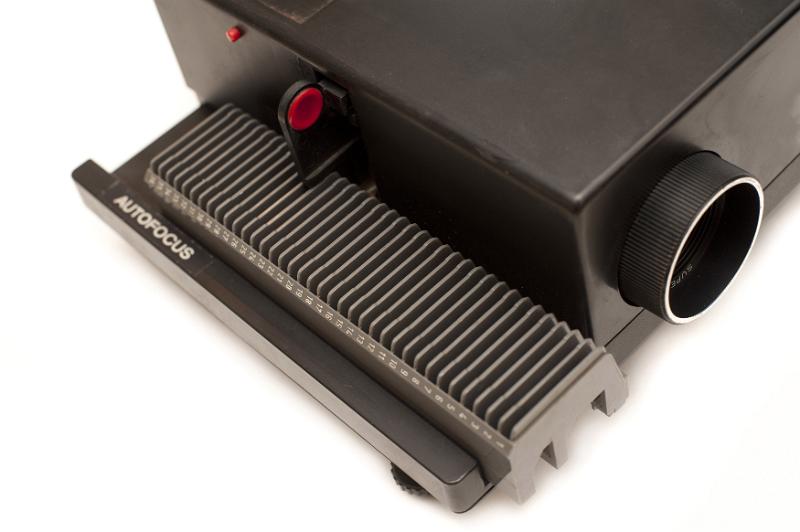 Free Stock Photo: Old slide projector with tray for the slides at the side in an entertainment and communication concept