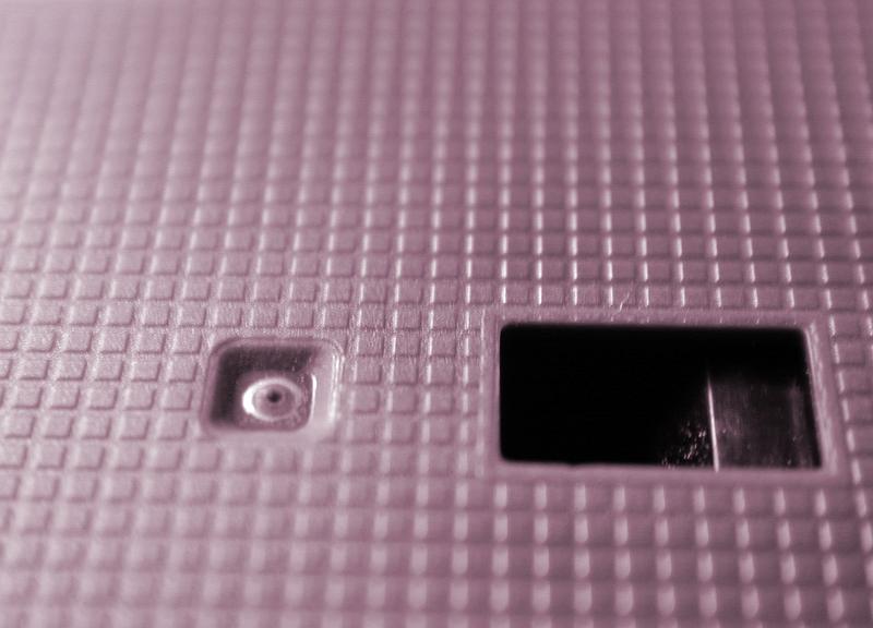 Free Stock Photo: Video cassette plastic case with technical holes - close-up full frame image