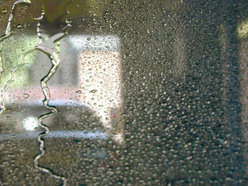 Free Stock Photo: Car wash abstract background with water droplets beaded on the glass of a vehicle window with the blurred outline of a second car in front