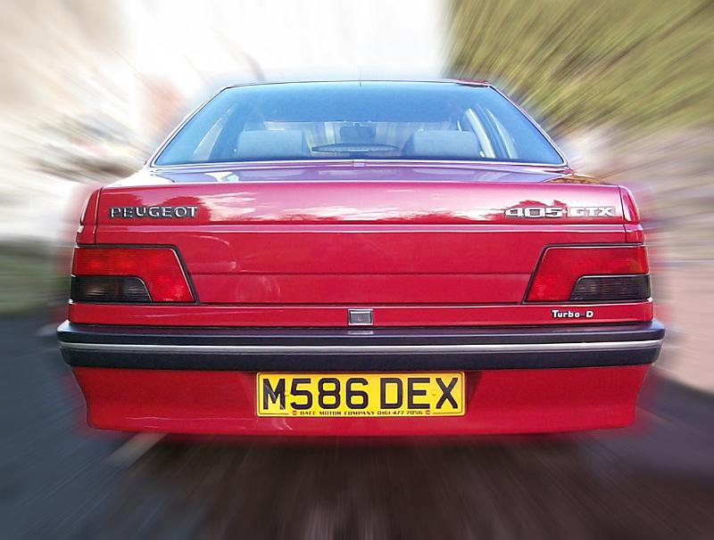 Free Stock Photo: Back view of red old car captured in fast motion while driving