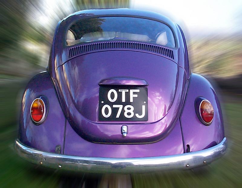 Free Stock Photo: Rear view of clean and well maintained purple car with motion effect around it outside