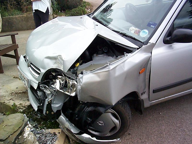 Free Stock Photo: Crop silver car with crashed front bumper outdoors.