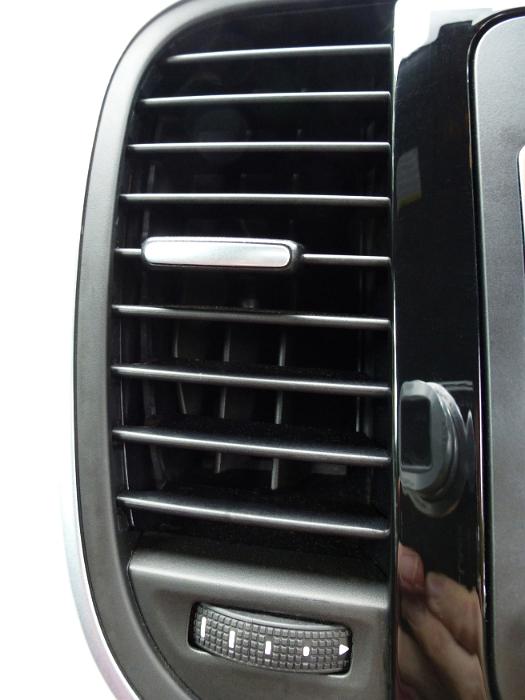 Free image of Car side air vent in a white car